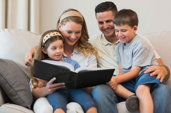 Family enjoying reading a photo album together