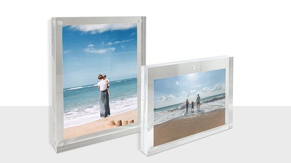 A Pair of acrylic photo display frames on shelf