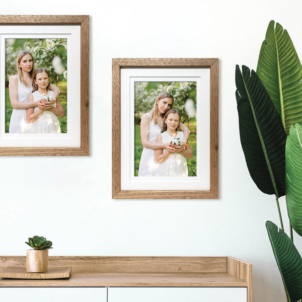 Ready Made Frames with Photos of Mother and Daughter hanging on wall