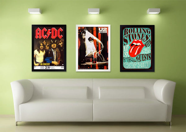 Interior shot of framed concert posters on a wall