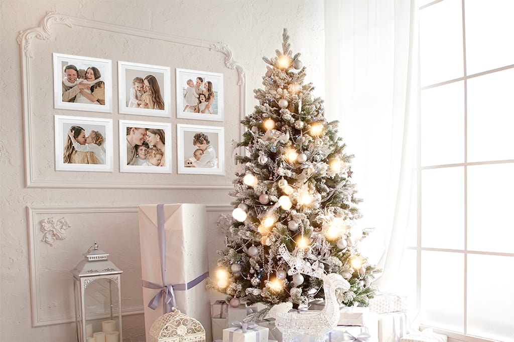 Christmas Tree with Gifts and Framed Photos on Wall