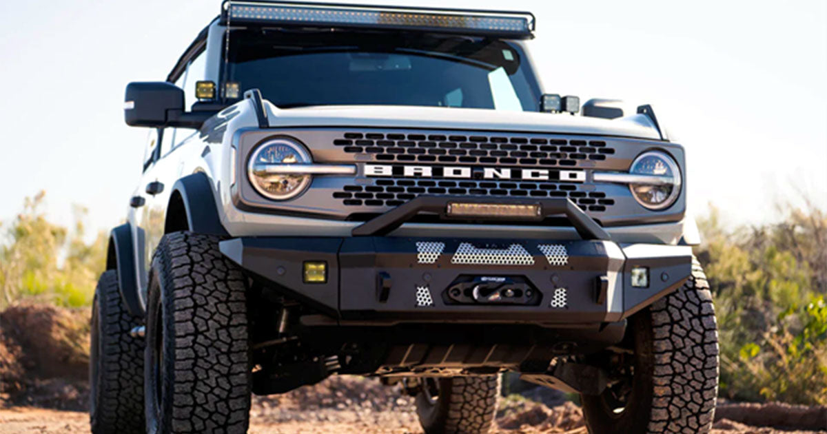 Grey Ford Bronco in desert.