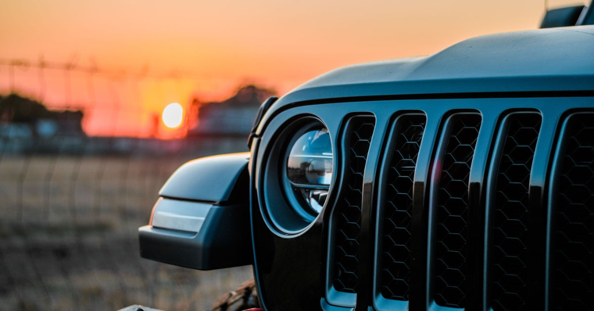 close up shot of the grill of a jeep