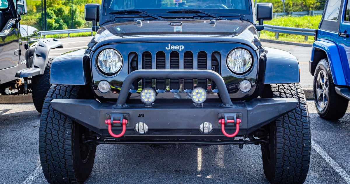 front of aftermarket jeep bumper in parking lot