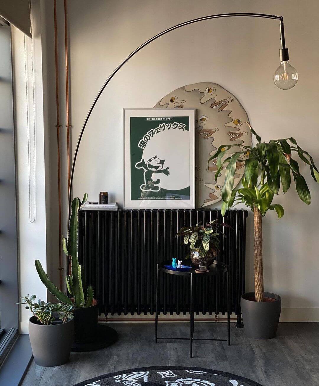 Living Room Interior With Natural Hues And A Green Artwork Leant Against The Wall