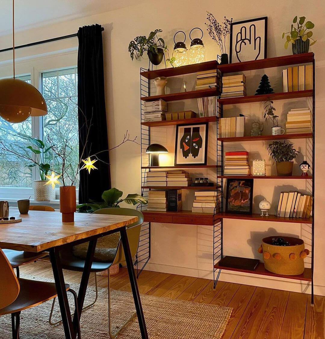 Shelving Unit Containing Books And Small Art Prints