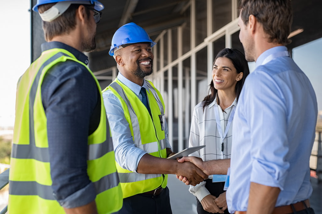 Engineer and businessman handshake