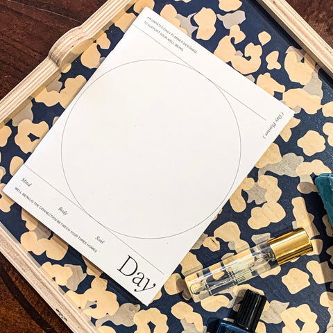 Wilde House Paper "Day Planner" displayed on navy cheetah tray
