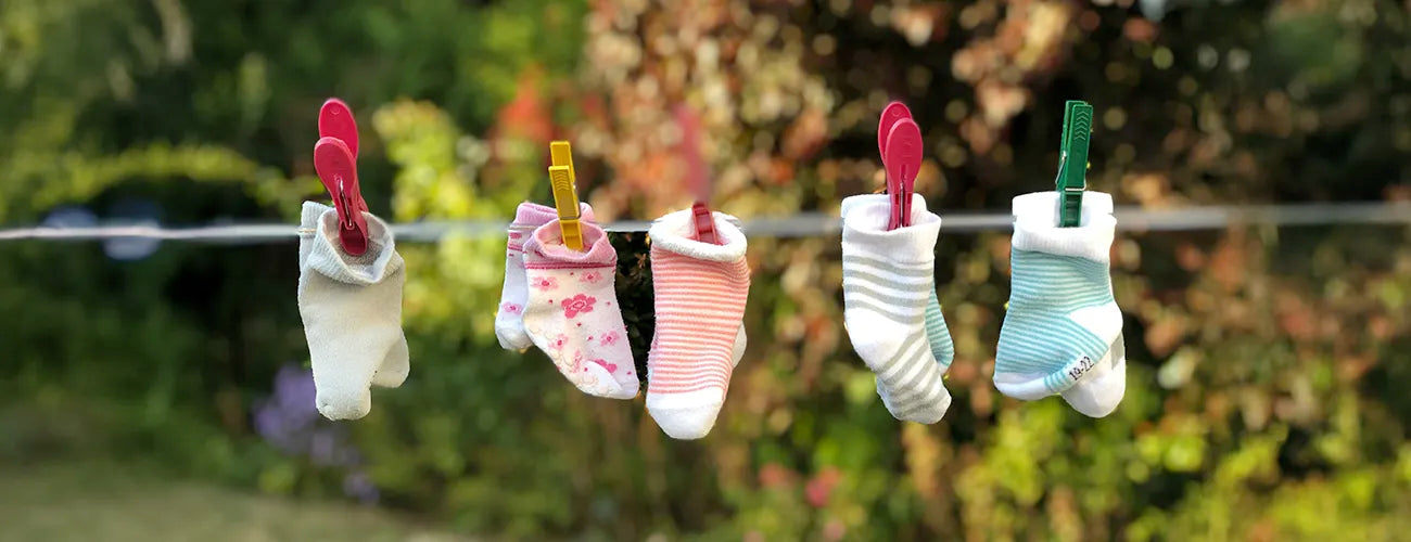 baby socks on a clothes line