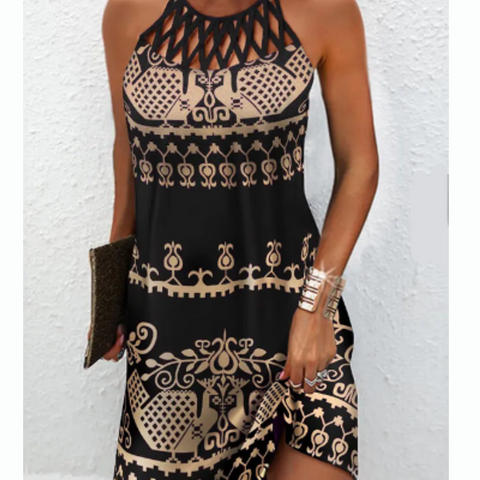 Black and tan printed sleeveless mini dress with hollow-out detailing on a black background.