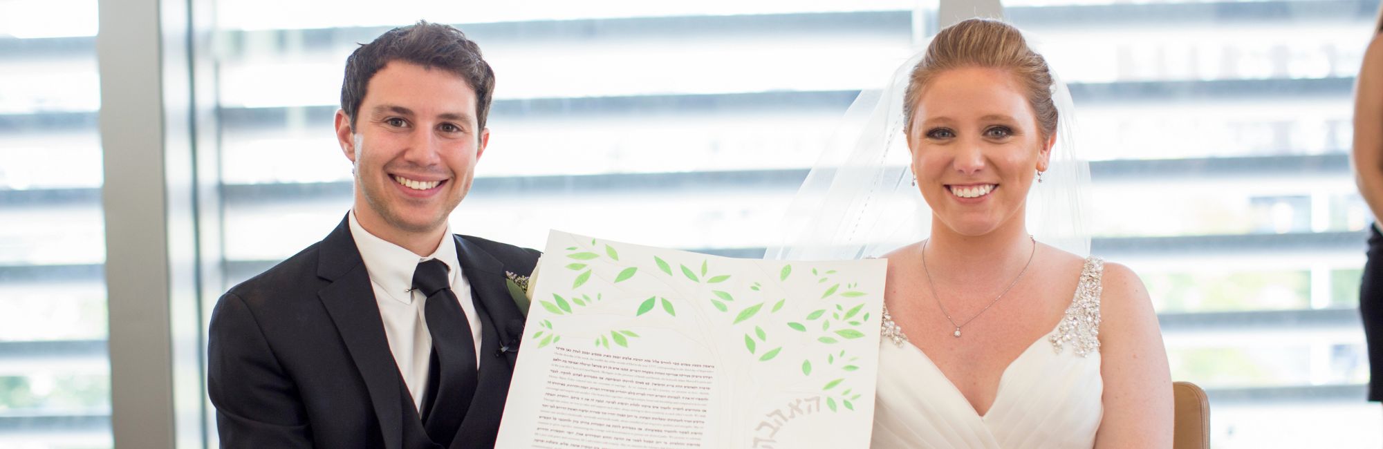 Bride and Groom Holding Their Jewish Wedding Vows