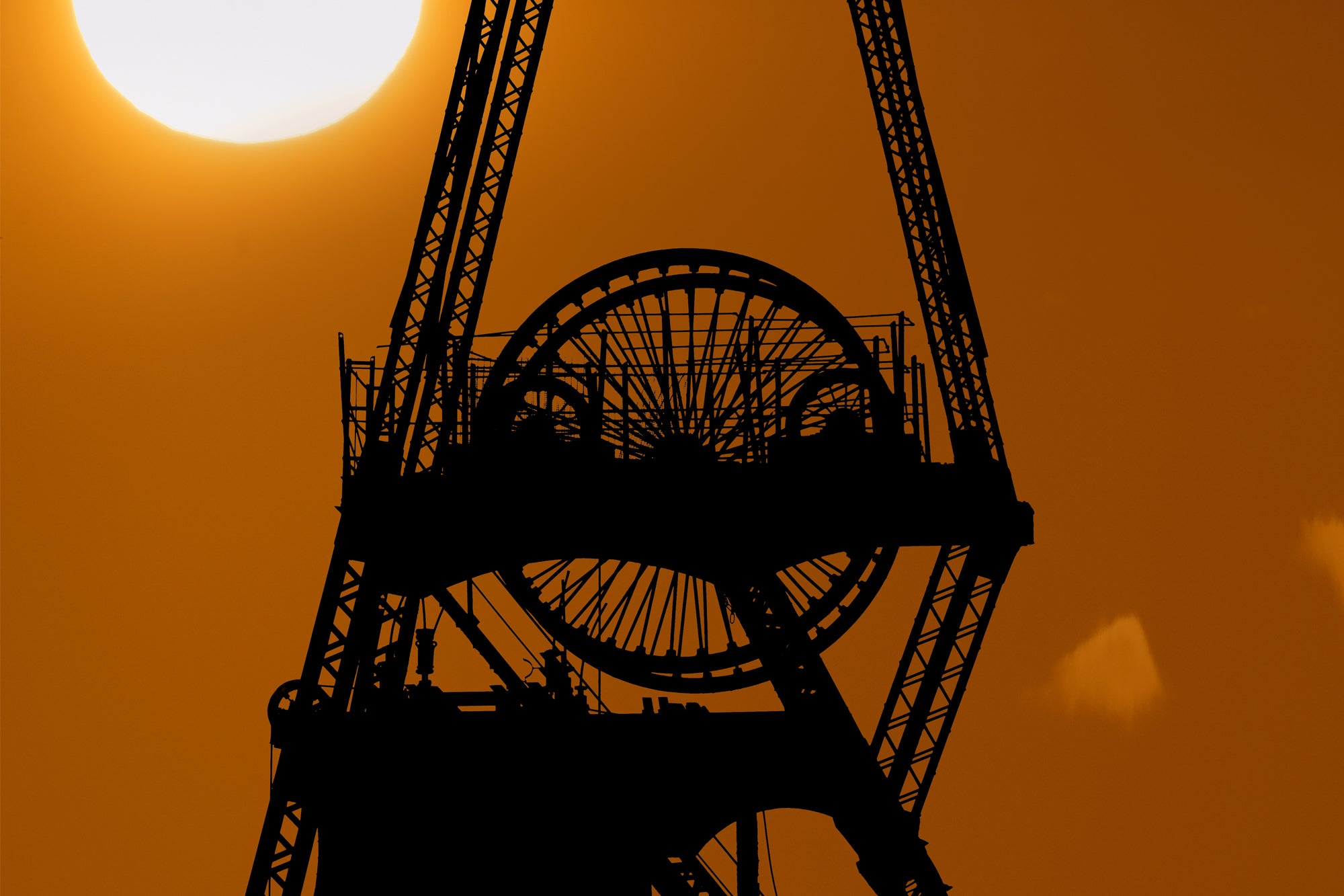 Pit wheel silhouette at sunset