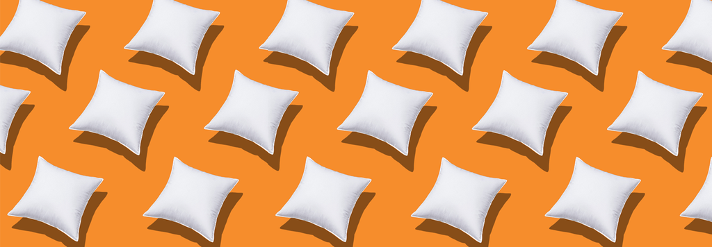 white cushions on orange background