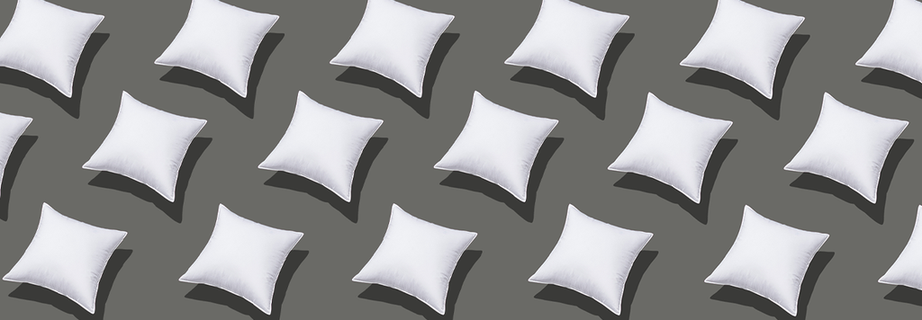 white cushions on a grey background