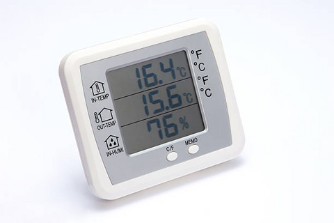 Using a thermostat to check the temperature and humidity inside the incubator