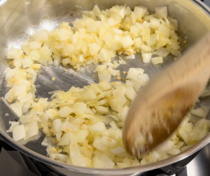 Add the chopped onion and sauté until the onion is translucent, about 5 minutes. Add the minced garlic and saute for 2 more minutes.