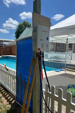 Camplux portable water heater hanging near a pool