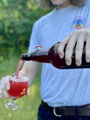 Blackberries + Hops being poured into glass