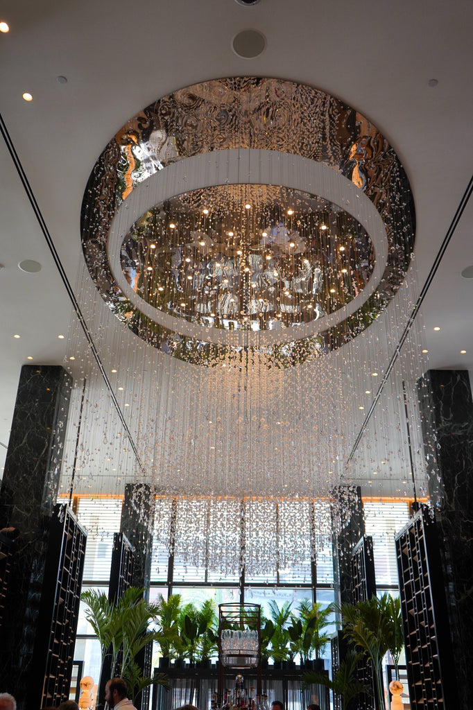 An enormous crystal chandelier dangles over the Chandelier Bar.