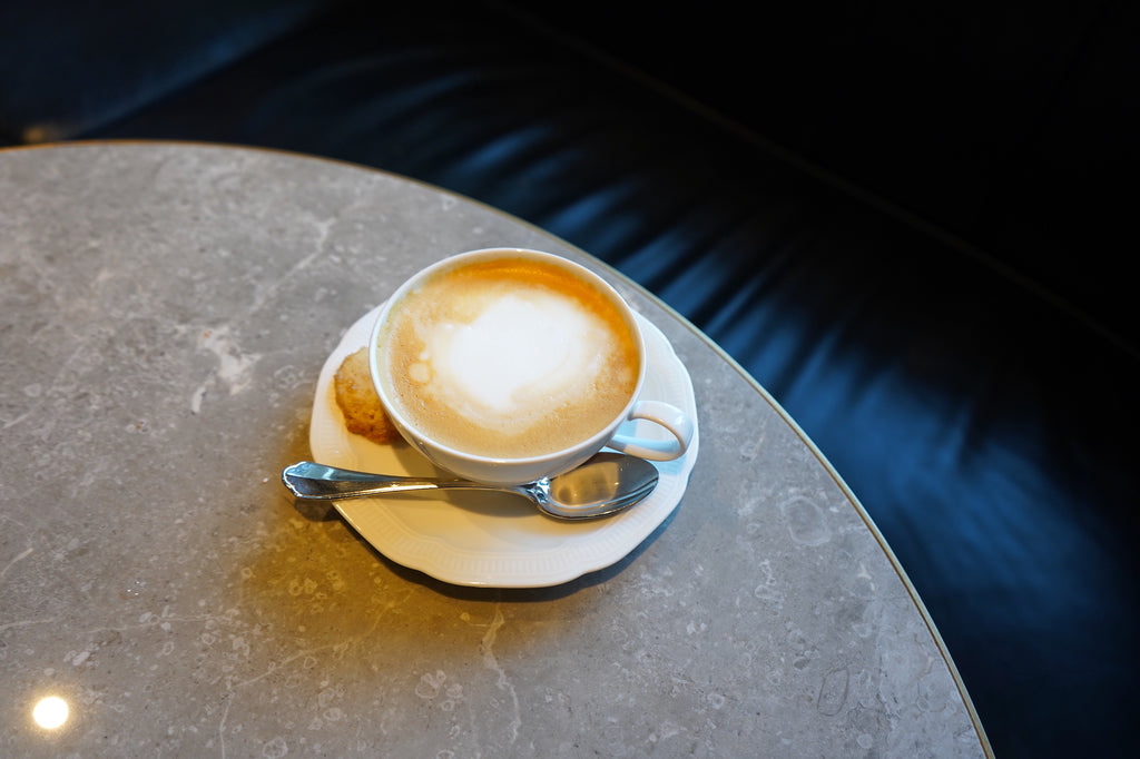 A cappuccino on a rounded tabletop