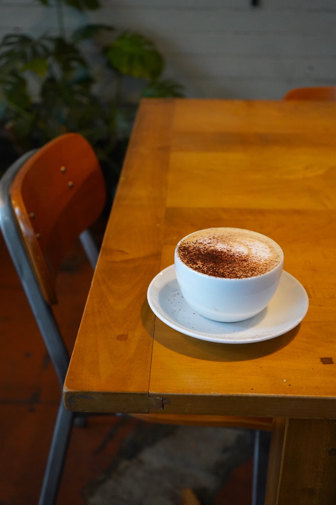A latte on the table of a cozy cafe