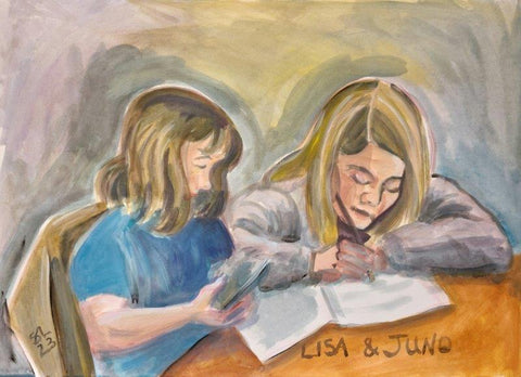 Children sitting at a table doing homework
