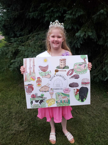 little girl is holding a poster she made; the poster features pictures of all the products at four harvest