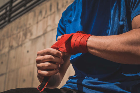 Example of someone wrapping their hands before boxing class