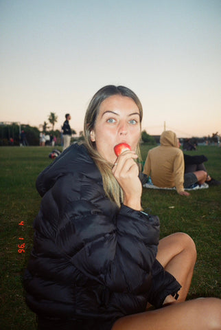 Girl eating a strawberry taken on Kodak Portra 400 35mm film