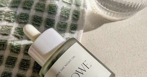 Image of skincare oil and towel for a rejuvenating oil cleansing ritual, promoting healthy and radiant skin