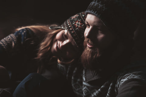 Couple cuddling outside at night