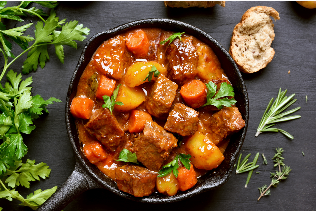 serve of slow cooked meats and vegetables with bread