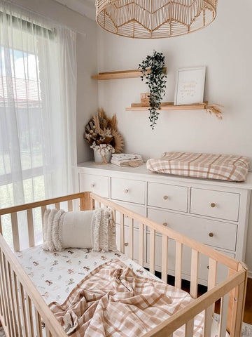 Gender Neutral Baby Nursery with a wooden cot and nappy change table. Featuring Snuggly Jacks Mystique and Earthy Plaid