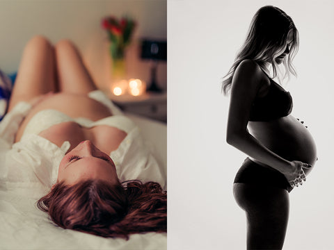 Pregnant women laying on her back on a bed wearing a tshirt and bra