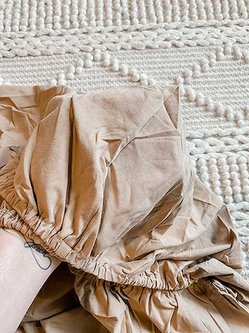 How to fold a fitted sheet Step 2.  Snuggly Jacks Fitted Camel Crib Sheet