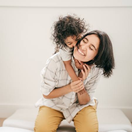 Child hugging mom