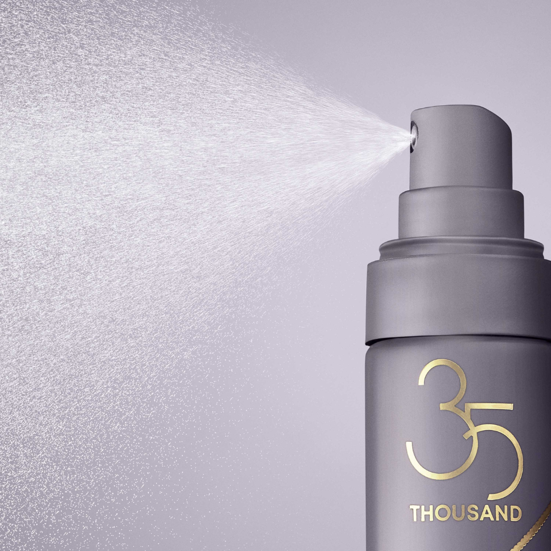 Fine mist spray being spritzed from Refresh & Revive Mist bottle