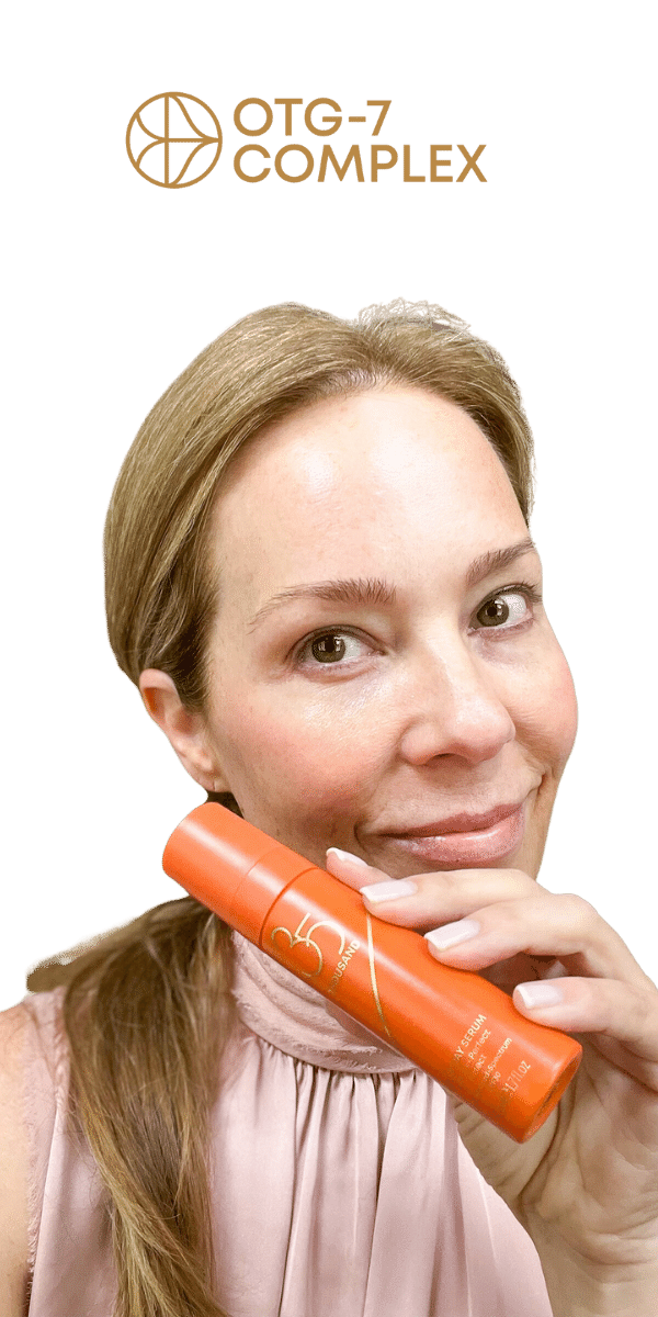 35 Thousand founder Misty Reich holding bottle of All-In Day Serum with SPF 30. Misty is wearing the sheer, tinted serum, giving her skin a luminous glow