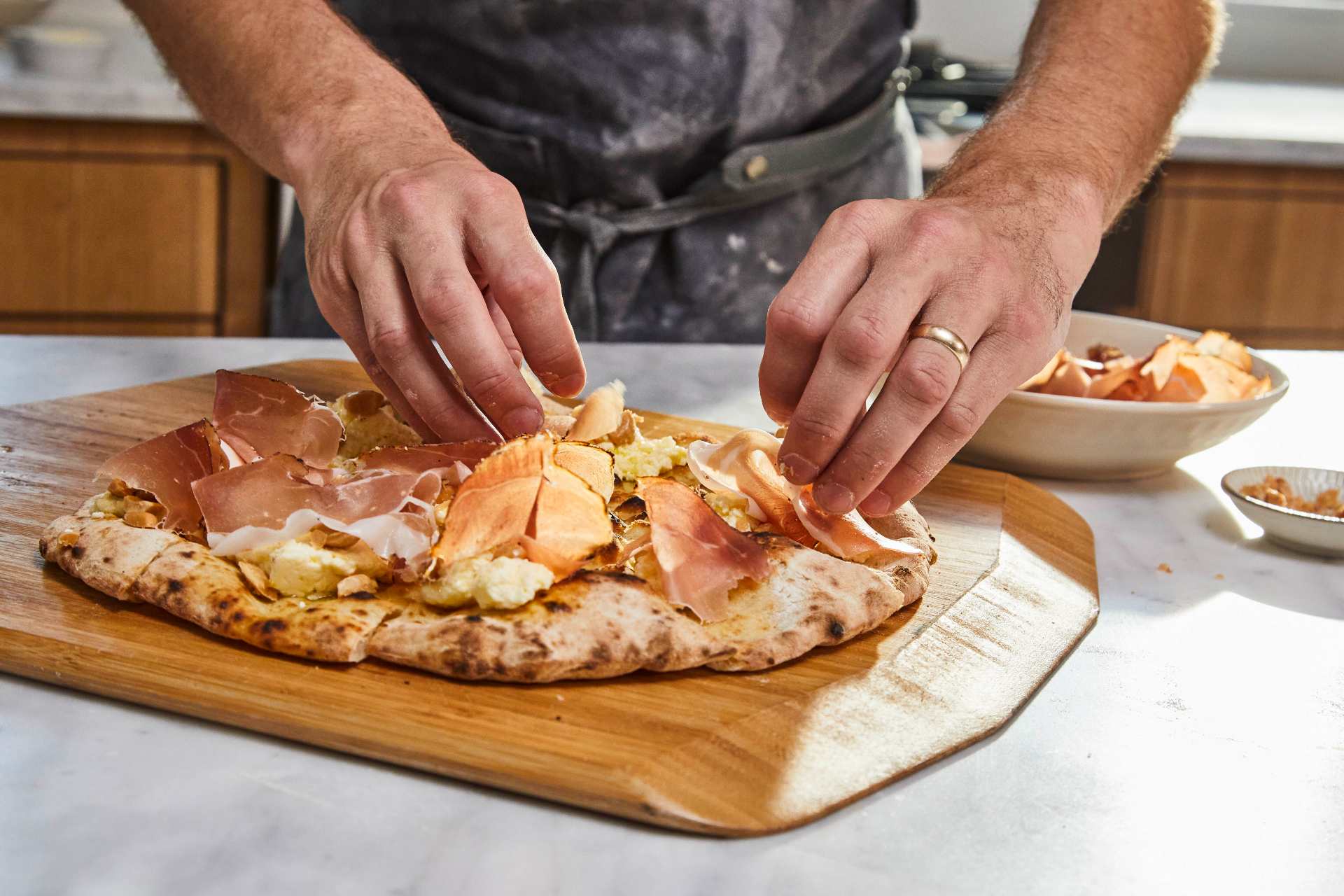 Pizza Crostini with Ricotta, Speck and Marcona Almonds