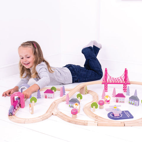 Girl playing with Fairy Town Train Set