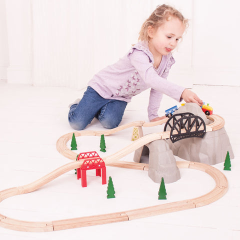 Girl playing with train toys expansion pack