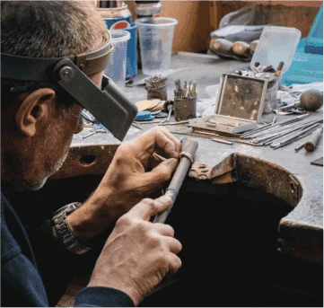 One of our artisans creating a bespoke piece of jewellery, using sustainably sourced metals and gemstones