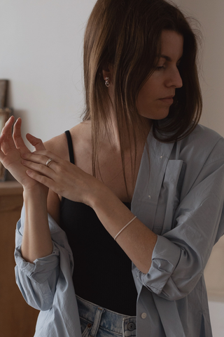 If your partner wears dainty silver bracelets, artful silver rings and elegant pearl earrings, they might not appreciate a thick gold band and bold ruby engagement ring. Choose something that matches their style