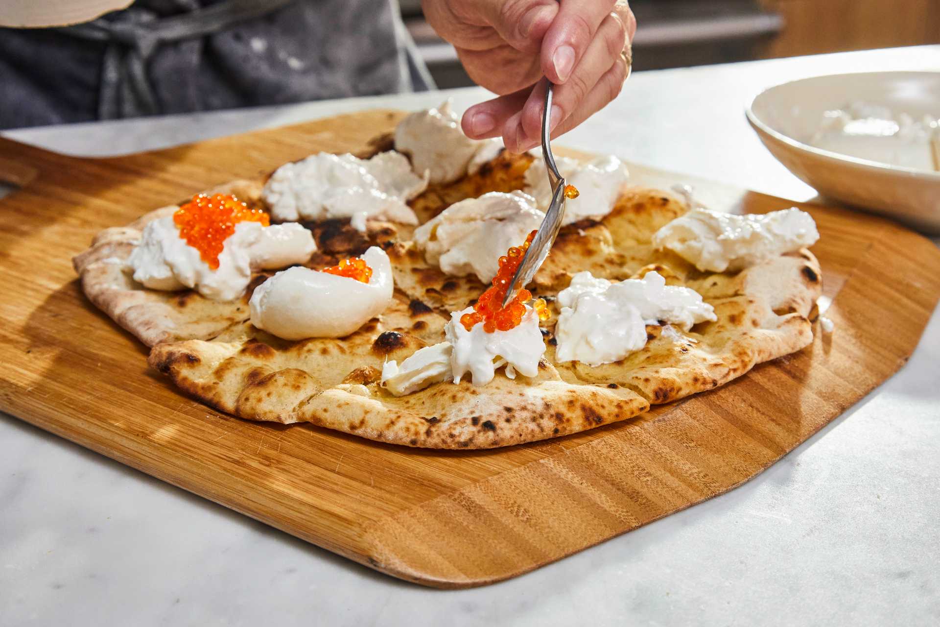 Pizza Crostini with Burrata and Trout Roe