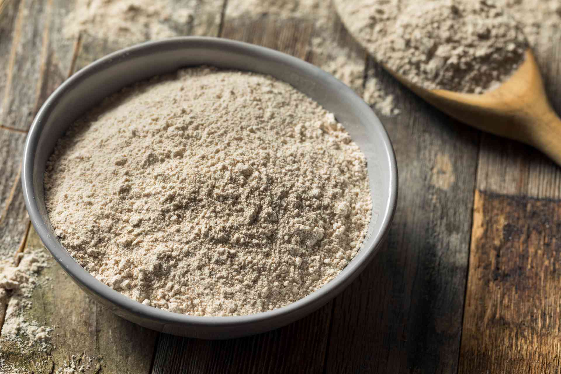 Whole wheat flour on a table in a bowl