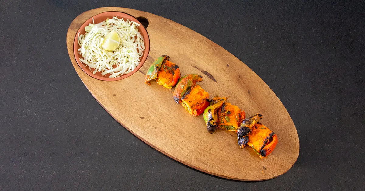 Paneer Tikka on wooden chopping board