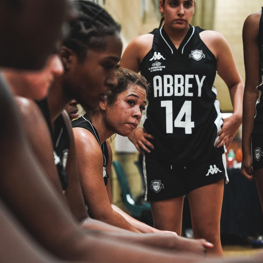 Female basketball players wearing the London Lions Kappa® kit.