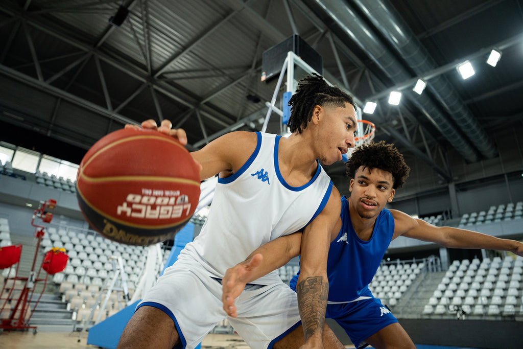 Two male basketball players in Kappa® kit.