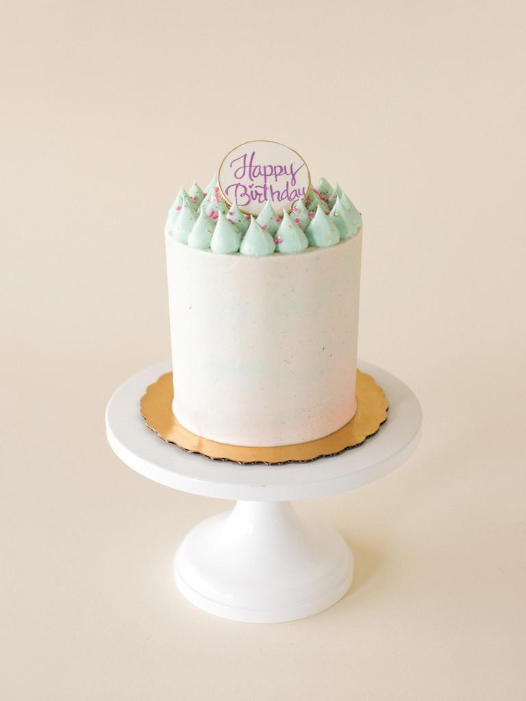 Cotton Candy Signature cake with edible happy birthday disc by Signature Birthday Oreo Cake by Jenna Rae Cakes