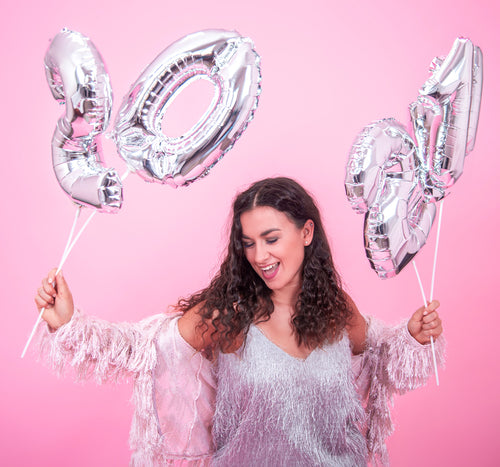 young-beautiful-girl-rejoices-new-year-pink-background-with-silver-balloons-new-year-concept.jpg__PID:ecd76d1c-4cf9-44e3-ad8f-f7583a3ddbfe